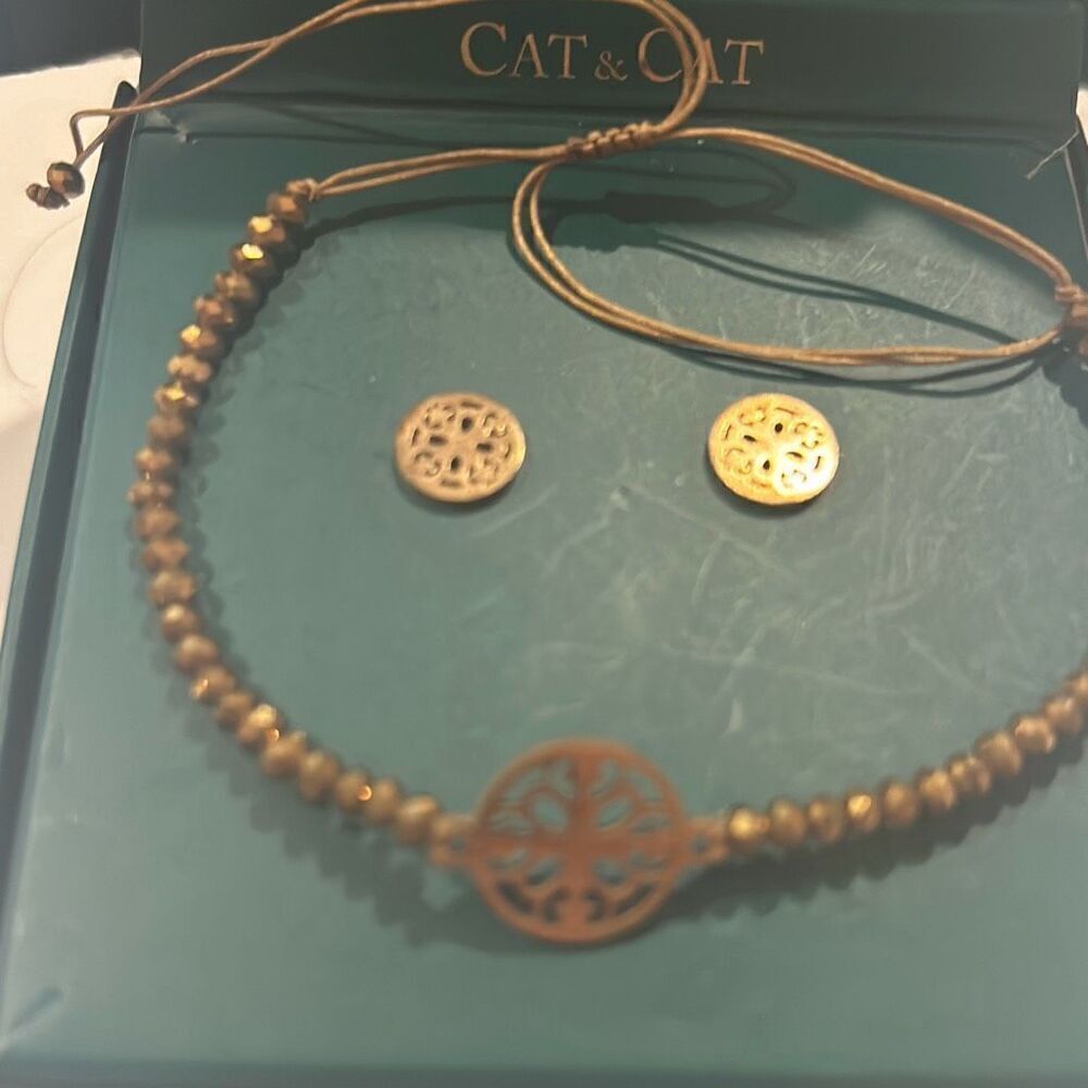 Cat & Cat beaded bracelet and matching earrings copper color.